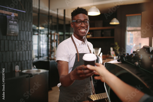 Photography Barista serving customers inside a coffee shop
