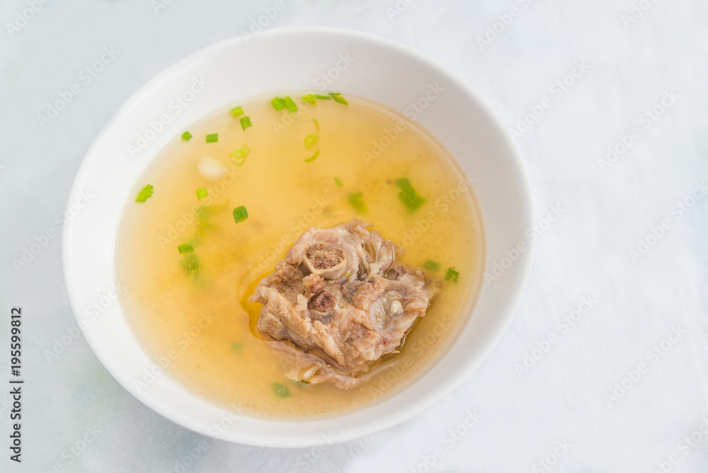The delicious pork bone soup for egg noodle and pork wonton with red roasted pork delicious street food of Thailand.
