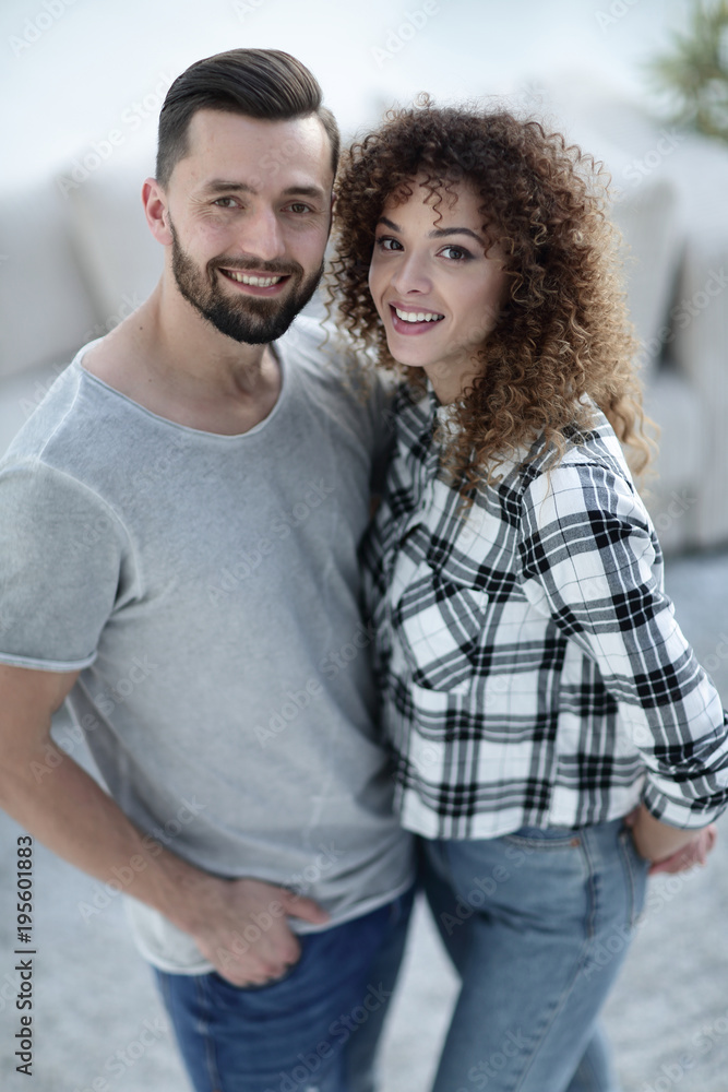 Beautiful young couple on a blurred background. Beautiful young couple on a blurred background.