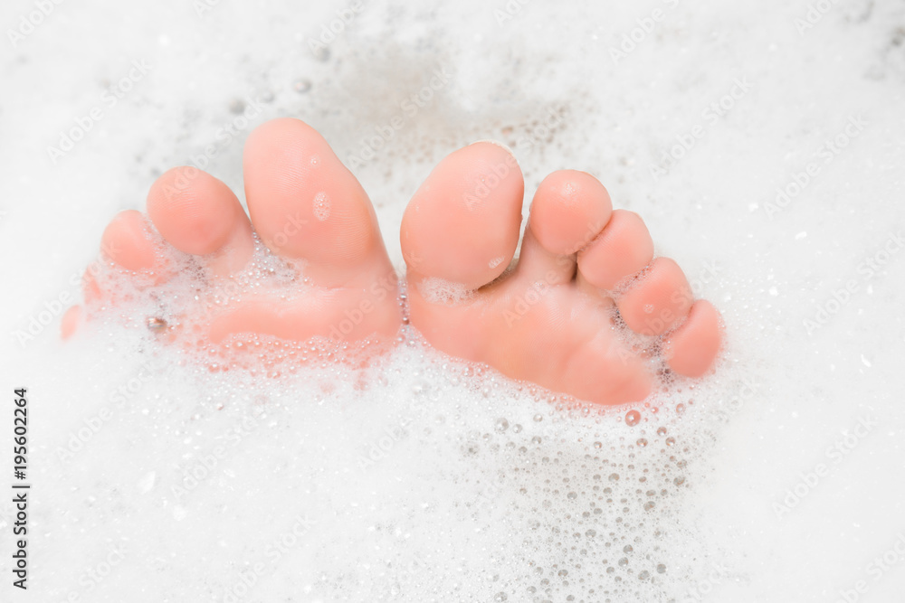 Foto de Elegant bare feet. Beautiful groomed woman's feet toes in the