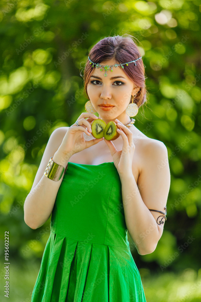 Beautiful young asian woman with kiwi Beautiful young asian woman with kiwi