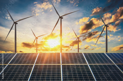 Obraz na plátne wind turbine with solar panels and sunset. concept clean energy