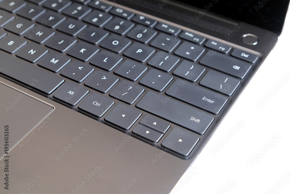 Part of opened laptop with keyboard, touchpad and empty mirror screen of black opened laptop isolated on white background side view closeup Part of opened laptop with keyboard, touchpad and empty mirror screen of black opened laptop isolated on white background side view closeup