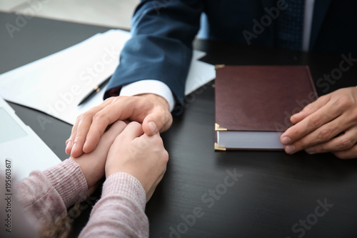 Lawyer having meeting with client in office, closeup