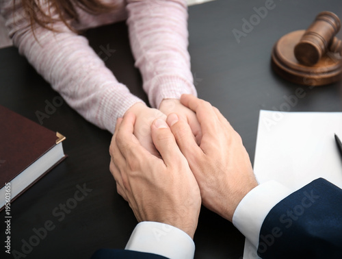Lawyer having meeting with client in office  closeup