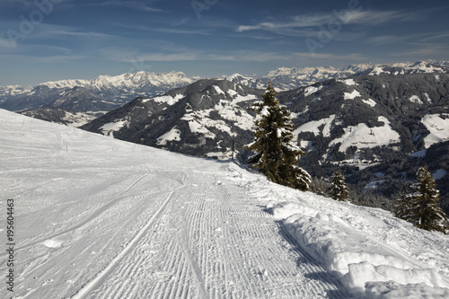 Panoramic winter view of the Alps from a ski slopes high in the mountain.