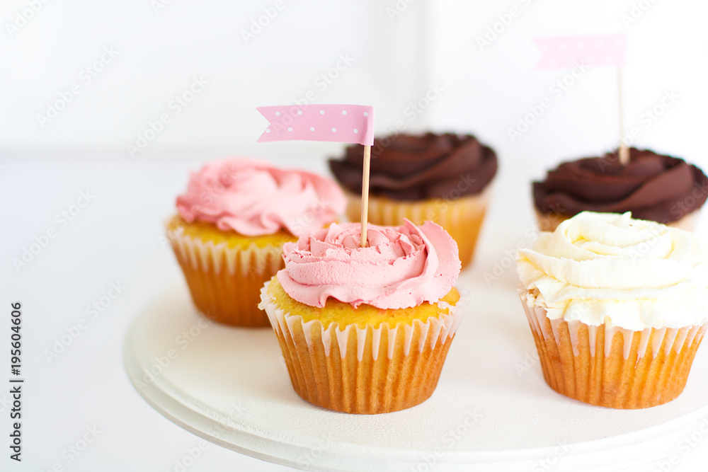 Cupcakes with flags on white background