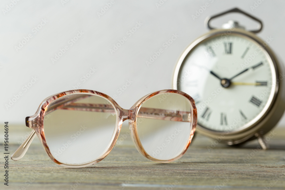 glasses and alarm clock glasses and alarm clock