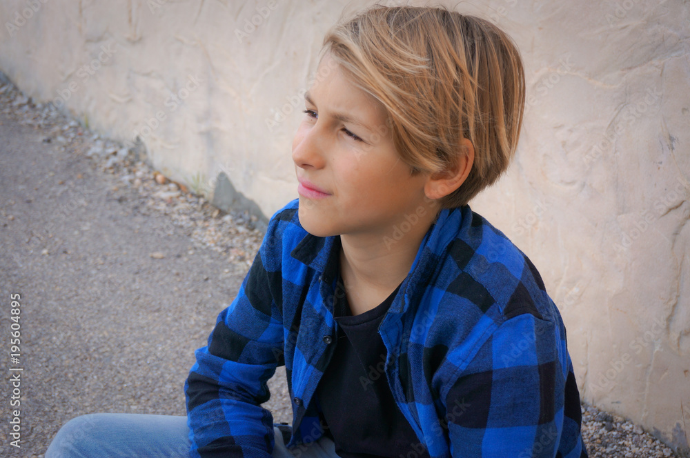 11 years old boy wearing blue squares shirt portrait 11 years old boy wearing blue squares shirt portrait
