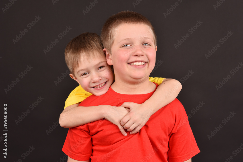 Funny children. A close friendship. A portrait of two joyful boys. Funny children. A close friendship. A portrait of two joyful boys.