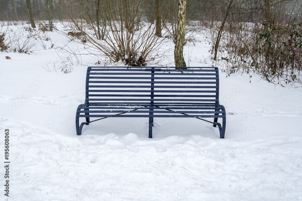 A bench on the slope of snow-covered hill - winter scenery 2