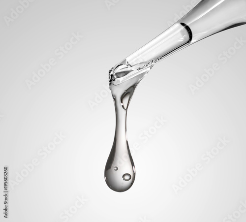 Liquid drop from laboratory glass Pipette photo