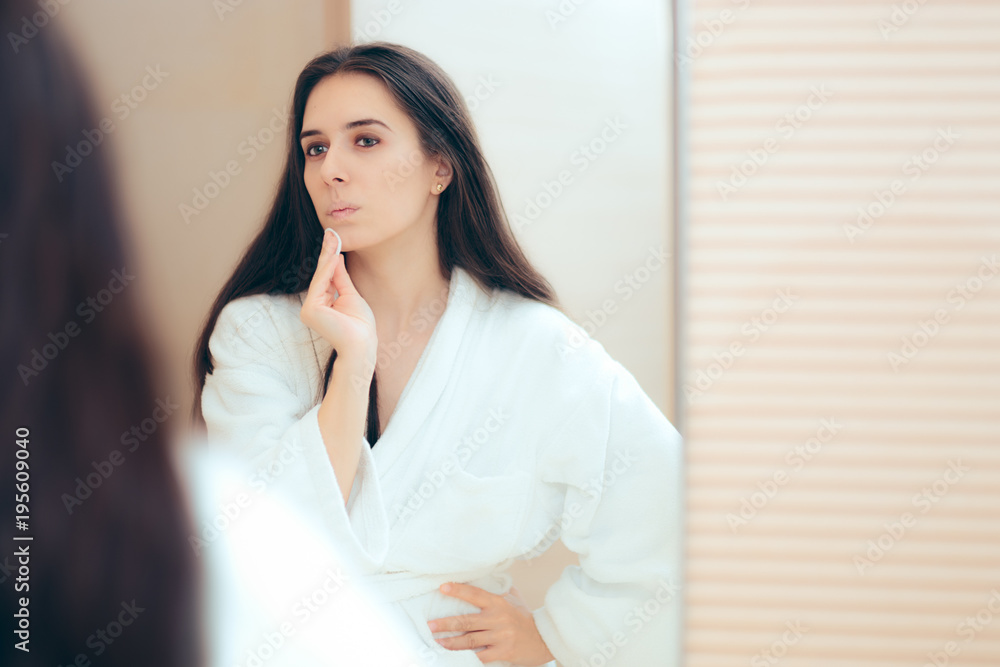 Woman in Bathrobe Cleaning Her Face with Make-up Remover Woman in Bathrobe Cleaning Her Face with Make-up Remover