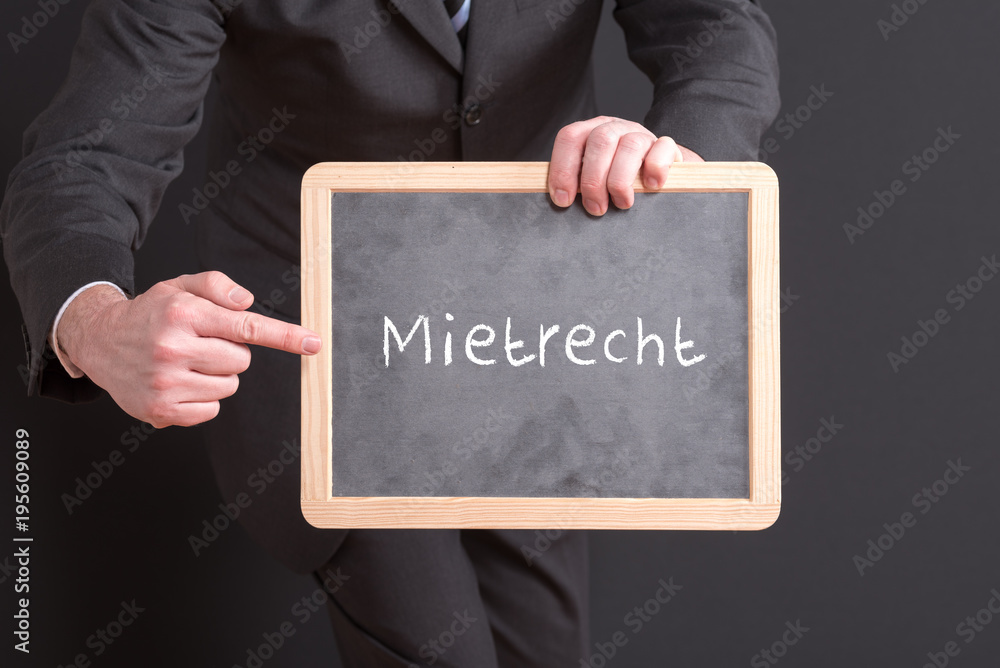 Anwalt Für Mietrecht In Der Nähe Anwalt mit einem Schild Mietrecht Stock-Foto | Adobe Stock