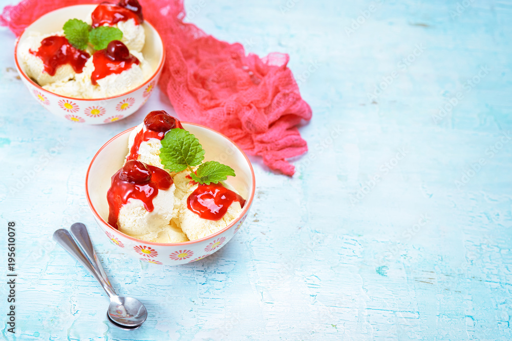Vanilla ice cream balls with red sauce Vanilla ice cream balls with red sauce