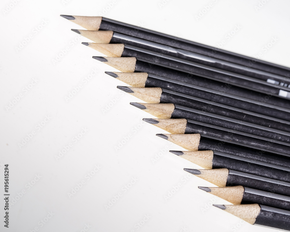 Fototapeta premium Black pencils on white background.