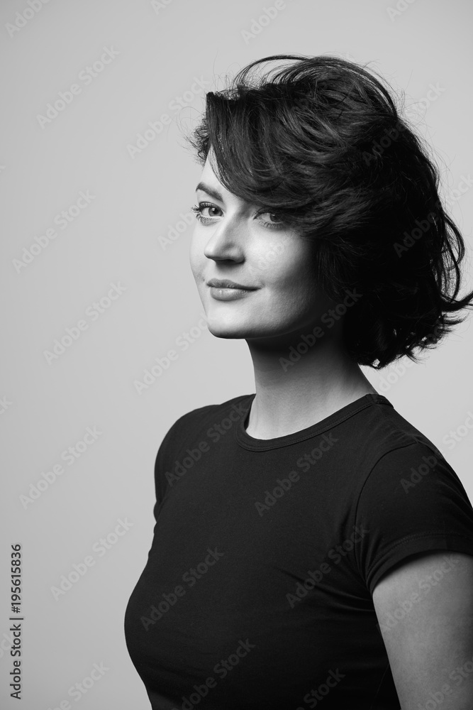 Bright brunette woman in black tshirt, black and white photo Bright brunette woman in black tshirt, black and white photo
