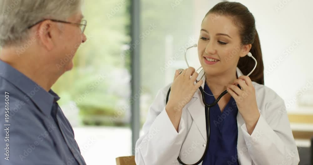 4K Friendly doctor examining elderly patient & showing him results on digital tablet. Slow motion. 4K Friendly doctor examining elderly patient & showing him results on digital tablet. Slow motion.