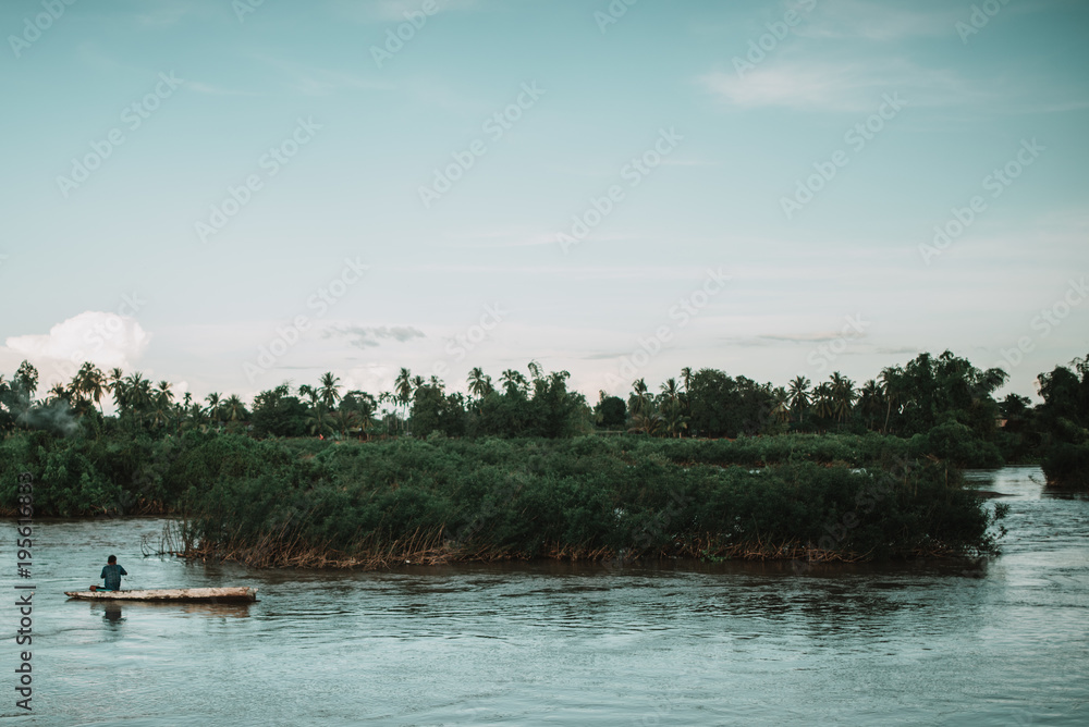 Unrecognizable?person riding boat Unrecognizable?person riding boat