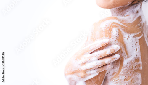A woman is taking a shower.