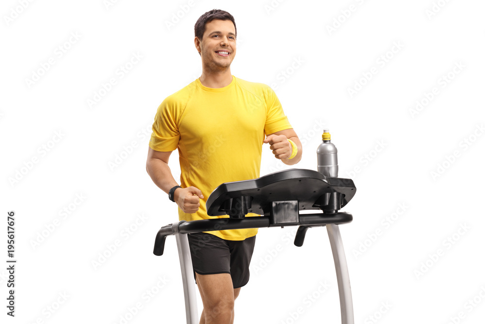 Young man exercising on a treadmill Young man exercising on a treadmill