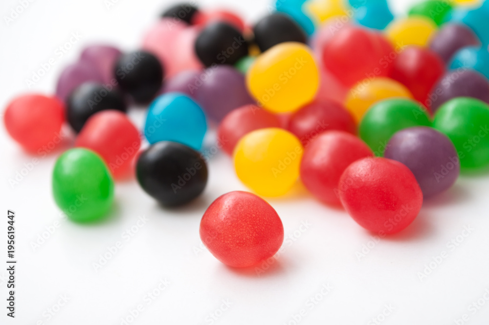 Obraz premium closeup of colorful round candies on white background