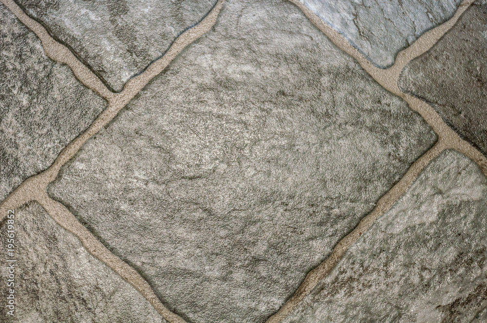 Obraz premium Pure gray shiny cobblestones in the form of rhombuses photographed from above closeup