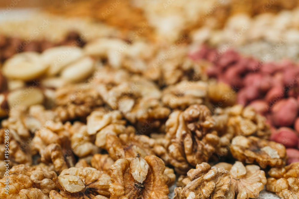 Nuts mix in a canvas bag in table. Ten kinds of nuts: pecan, brazil, cedar, sunflower, hazelnut, almond, peanut, walnut, pistachio, cashew. Nuts mix in a canvas bag in table. Ten kinds of nuts: pecan, brazil, cedar, sunflower, hazelnut, almond, peanut, walnut, pistachio, cashew.