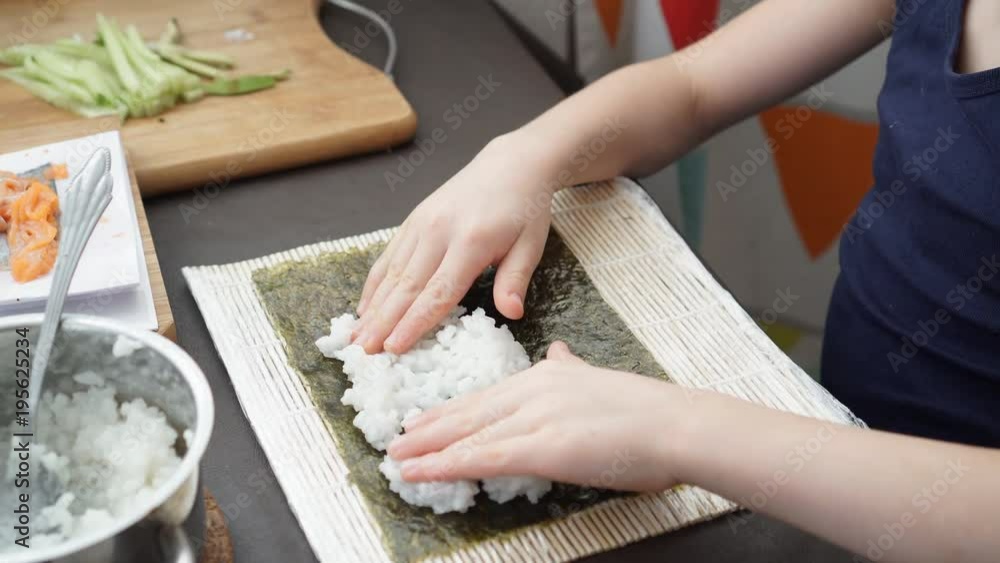 Caucasian six year old child learns to prepare rolls. Hands in the frame Caucasian six year old child learns to prepare rolls. Hands in the frame