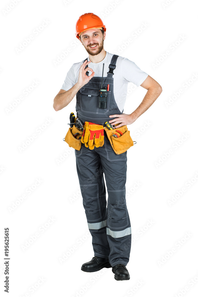 A man builder shows a hand gesture. Repair and construction. Isolated over white background. A man builder shows a hand gesture. Repair and construction. Isolated over white background.