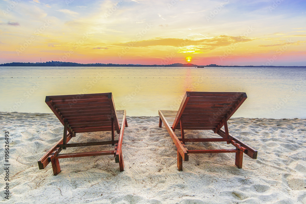 Beach chair at sunset