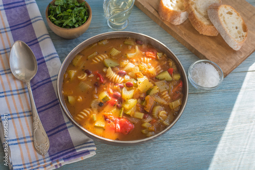 Traditional seasonal minestrone soup with beans and pasta