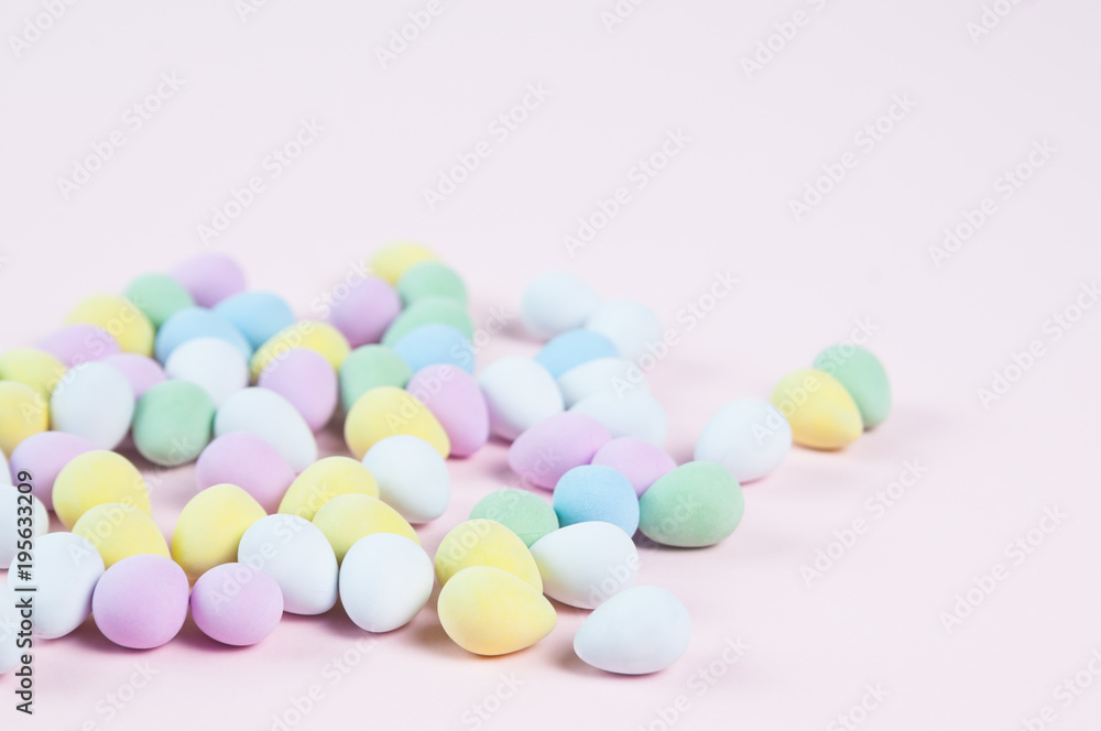 pastel colored easter eggs on a pink background pastel colored easter eggs on a pink background