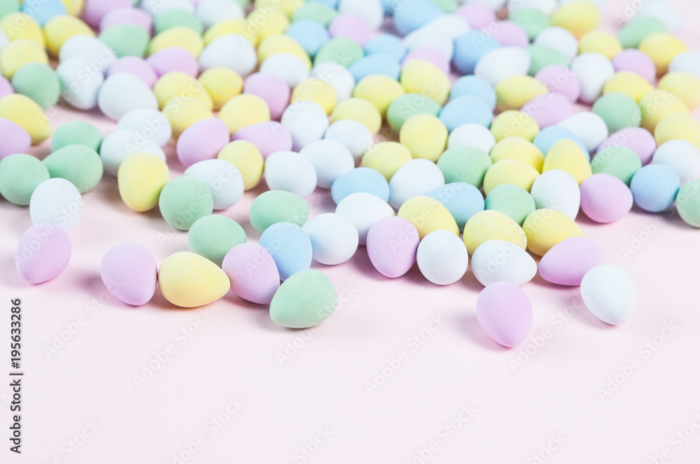 pastel colored easter eggs on a pink background pastel colored easter eggs on a pink background