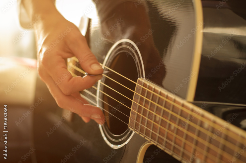 Obraz premium playing acoustic guitar