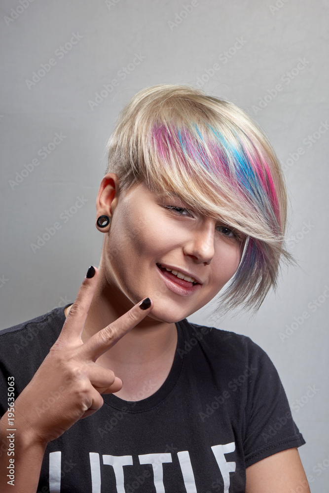Portrait of young woman with trend dyed hair, professional hair coloring Portrait of young woman with trend dyed hair, professional hair coloring