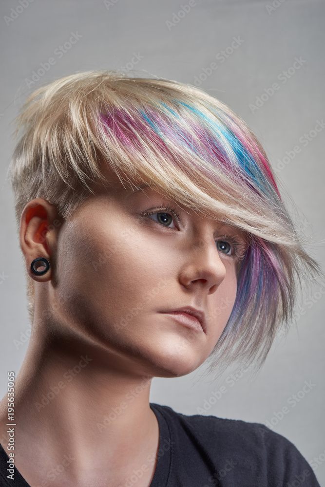 Portrait of young woman with trend dyed hair, professional hair coloring