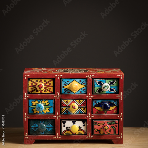 Small painted box with drawers for spices