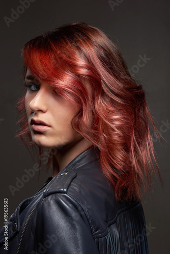 Portrait of young woman with trend dyed hair, professional hair coloring