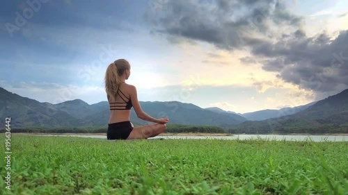 Wallpaper Mural Closeup Girl Meditates in Yoga Pose Lotus against Hilly Land Torontodigital.ca