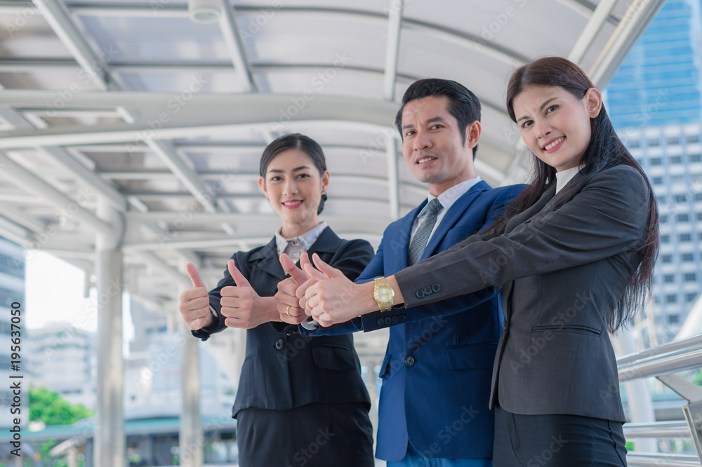 business man and business woman smile and show thumb up two hand at the city, successful concept business man and business woman smile and show thumb up two hand at the city, successful concept