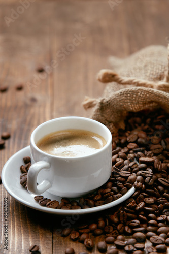 Cup Of Coffee. Hot Drink And Beans On Table.