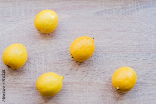 top view of fresh lemon fruits on wooden table