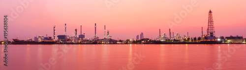 Panorama view of Oil refinery at the river in sunrise time