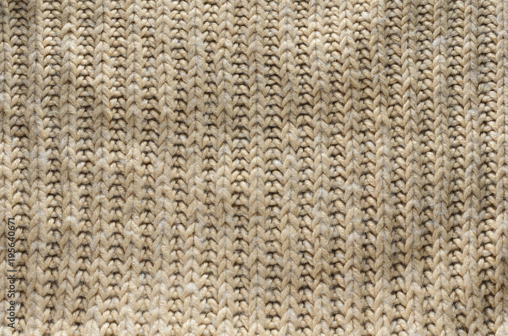 Knit texture of wool knitted fabric with regular pattern as background Knit texture of wool knitted fabric with regular pattern as background