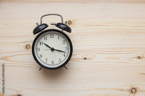 alarm clock on a wooden background