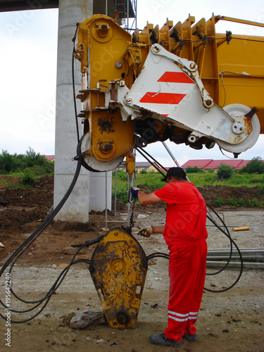 Bild auf Leinwand The mechanic repair the crane