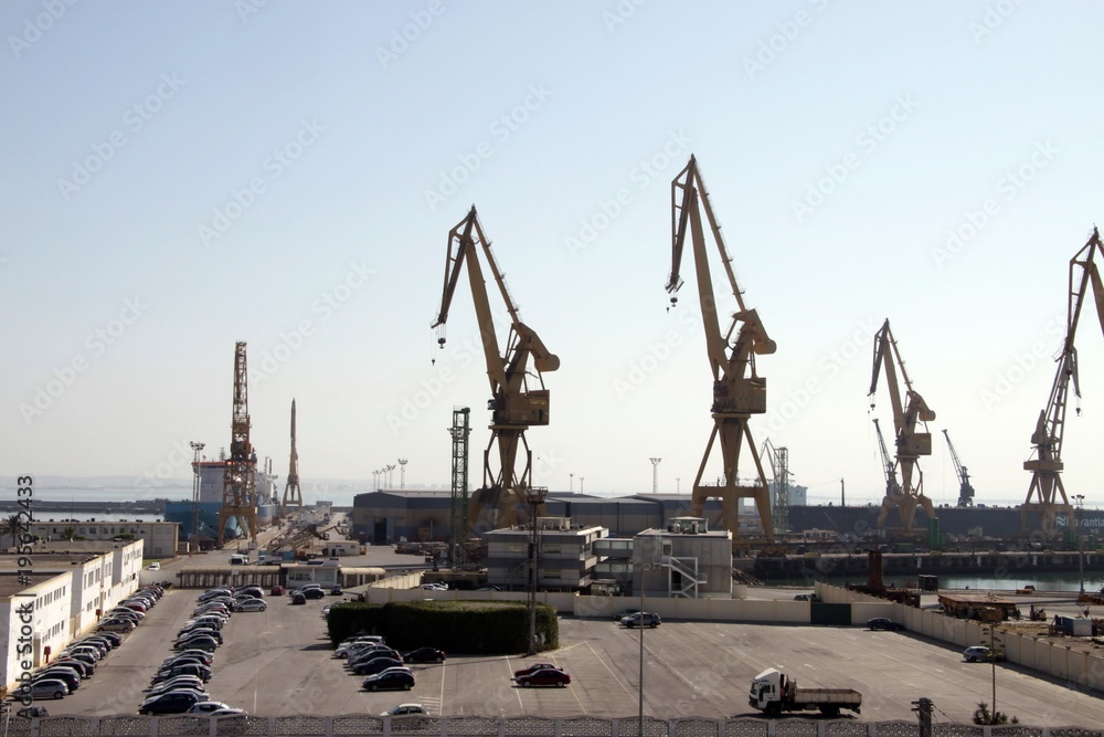 Port cranes in the ancient sea port of Cadiz on the Atlantic ocean.