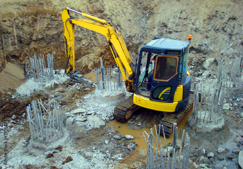 Mini excavator on the construction site