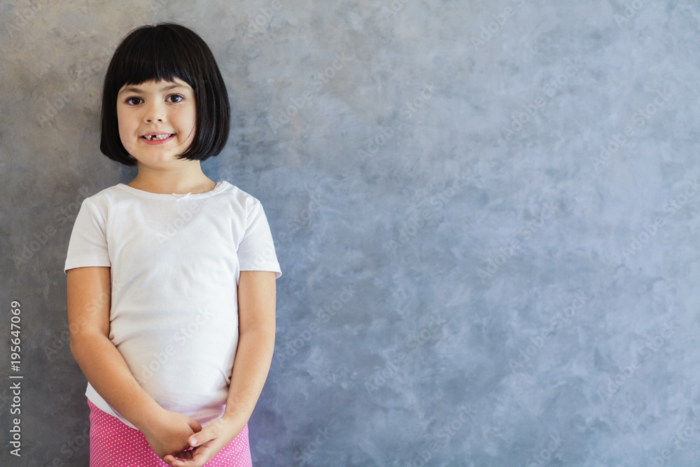 Little blackhair girl by wall Little blackhair girl by wall